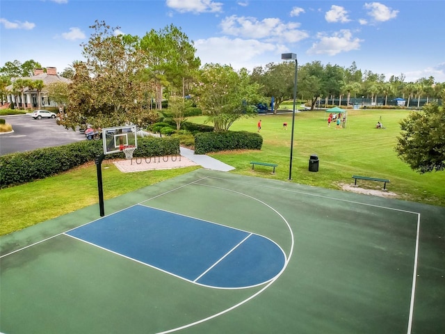 view of basketball court featuring community basketball court and a yard