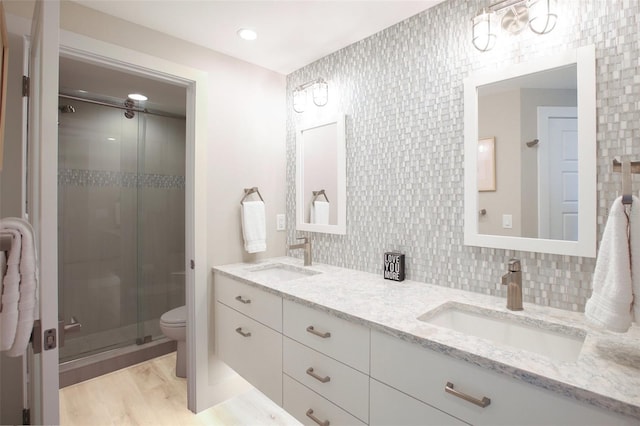7540 Sunshine Skyway Ln S Unit 217, Saint Petersburg, FL 33711 - full bathroom featuring a sink, a shower stall, toilet, and double vanity