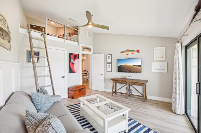 7540 Sunshine Skyway Ln S Unit 217, Saint Petersburg, FL 33711 - living area featuring a ceiling fan, visible vents, baseboards, light wood finished floors, and lofted ceiling