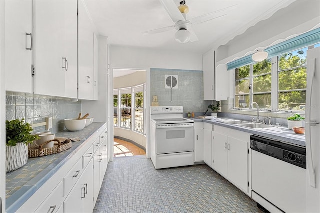 kitchen with ceiling fan, white appliances, decorative backsplash, and a sink