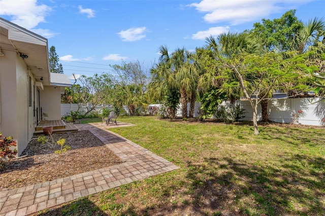 view of yard featuring a wooden deck and a fenced backyard