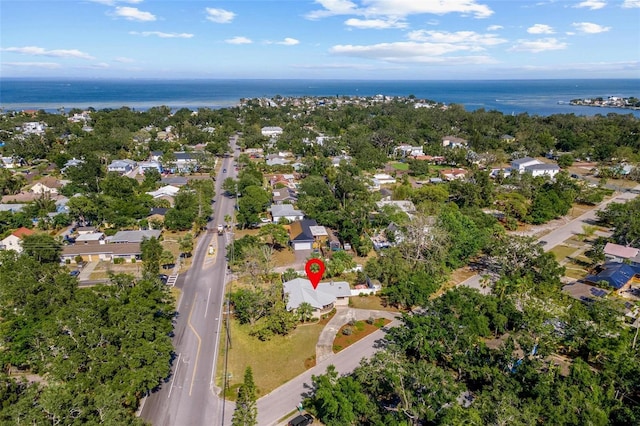 drone / aerial view with a residential view and a water view