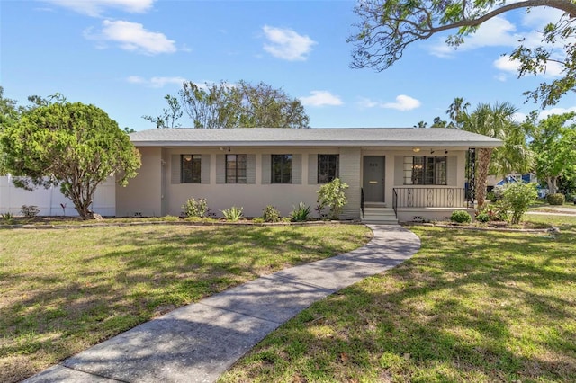 single story home with a porch and a front yard