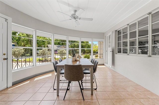 sunroom featuring tile patterned flooring and plenty of natural light