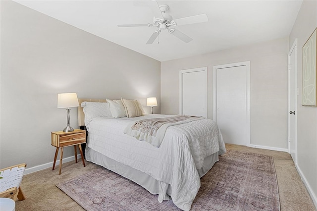 carpeted bedroom featuring a ceiling fan and baseboards