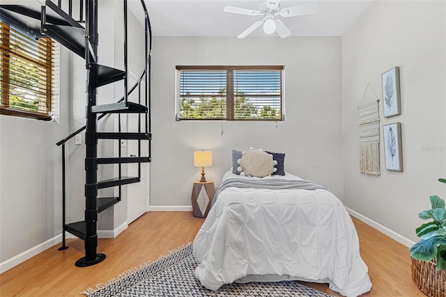 bedroom featuring baseboards and light wood-style floors