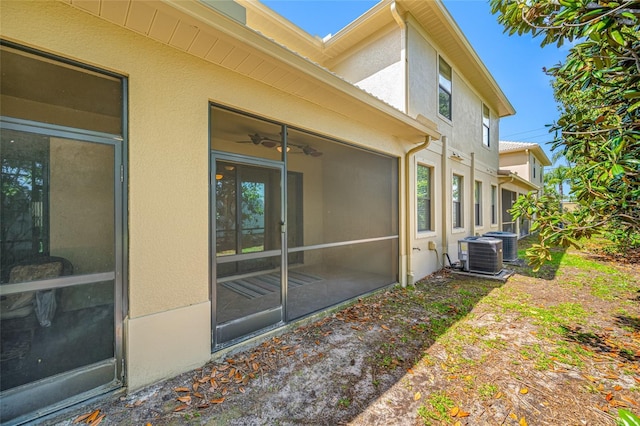 2527 Silverback Ct, Palm Harbor, FL 34684 - exterior space with central AC unit and stucco siding