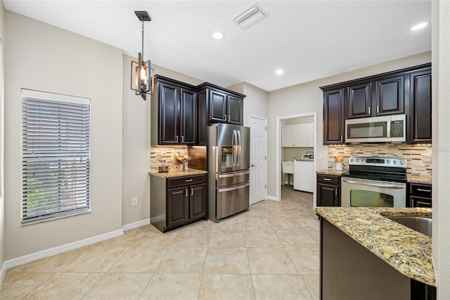 2527 Silverback Ct, Palm Harbor, FL 34684 - kitchen featuring visible vents, light stone countertops, baseboards, tasteful backsplash, and appliances with stainless steel finishes