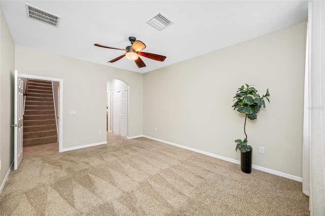 2527 Silverback Ct, Palm Harbor, FL 34684 - unfurnished bedroom featuring arched walkways, visible vents, and carpet
