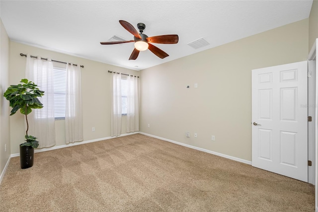 2527 Silverback Ct, Palm Harbor, FL 34684 - empty room featuring carpet, visible vents, a ceiling fan, and baseboards