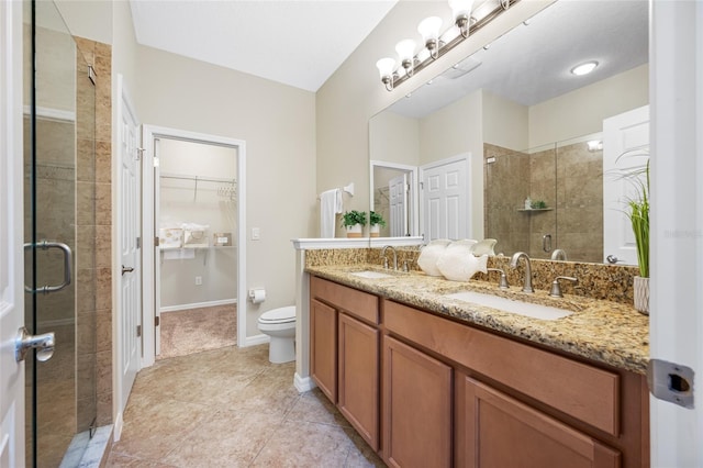 2527 Silverback Ct, Palm Harbor, FL 34684 - bathroom with a spacious closet, a sink, and a shower stall