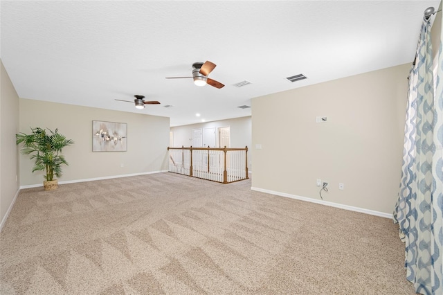 2527 Silverback Ct, Palm Harbor, FL 34684 - carpeted spare room with visible vents, baseboards, and ceiling fan