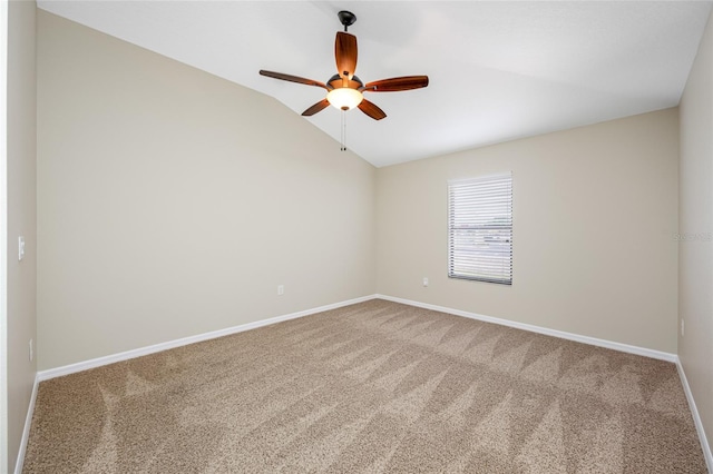 2527 Silverback Ct, Palm Harbor, FL 34684 - carpeted spare room featuring vaulted ceiling, baseboards, and ceiling fan
