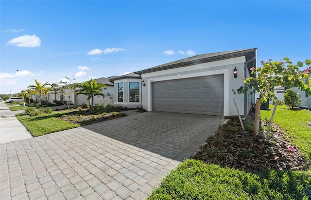 2528 Charter Oak Dr, North Port, FL 34289 - view of front facade featuring stucco siding, an attached garage, and decorative driveway