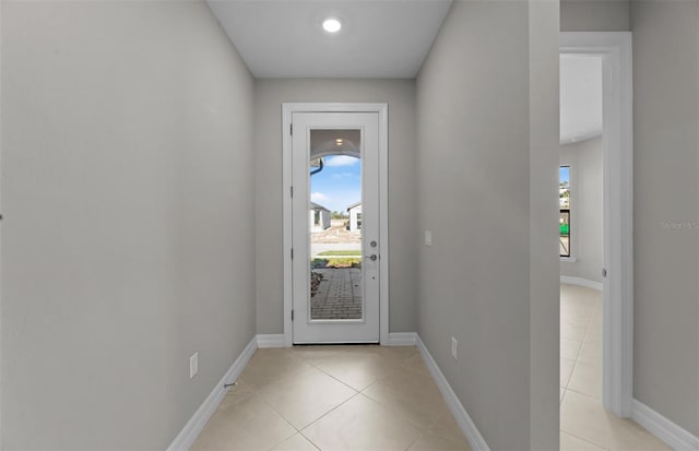 2528 Charter Oak Dr, North Port, FL 34289 - doorway to outside with baseboards and light tile patterned floors