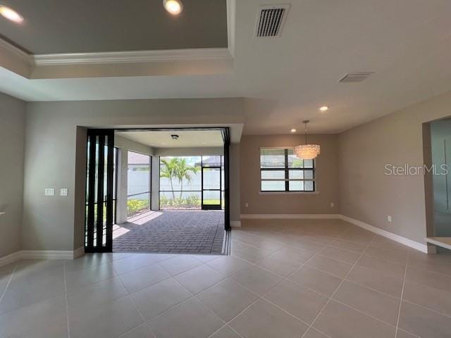 2528 Charter Oak Dr, North Port, FL 34289 - interior space with baseboards, visible vents, ornamental molding, and a tray ceiling