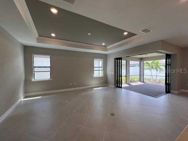 2528 Charter Oak Dr, North Port, FL 34289 - empty room with baseboards, visible vents, and a raised ceiling