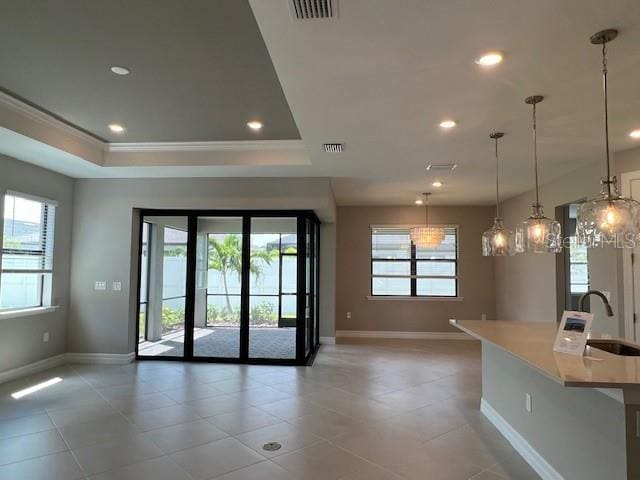 2528 Charter Oak Dr, North Port, FL 34289 - doorway to outside featuring baseboards, visible vents, and a sink