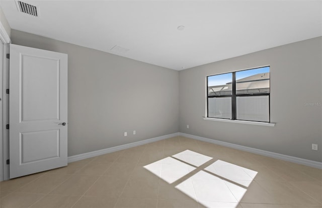 2528 Charter Oak Dr, North Port, FL 34289 - unfurnished room with visible vents, baseboards, and light tile patterned floors