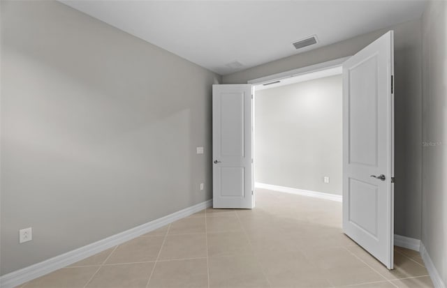 2528 Charter Oak Dr, North Port, FL 34289 - unfurnished room with light tile patterned flooring, visible vents, and baseboards