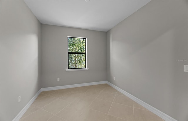 2528 Charter Oak Dr, North Port, FL 34289 - unfurnished room with baseboards and light tile patterned floors