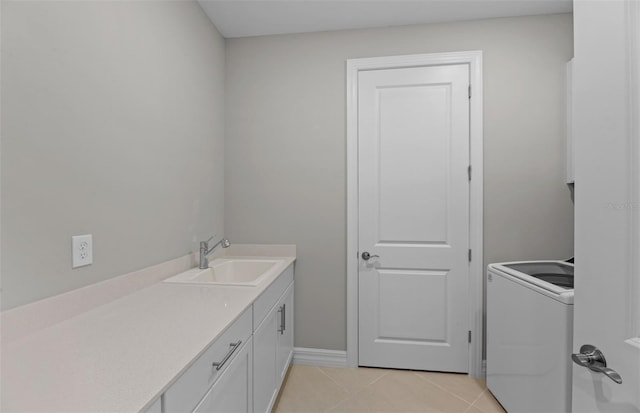 2528 Charter Oak Dr, North Port, FL 34289 - bathroom with baseboards, tile patterned floors, vanity, and washer / clothes dryer