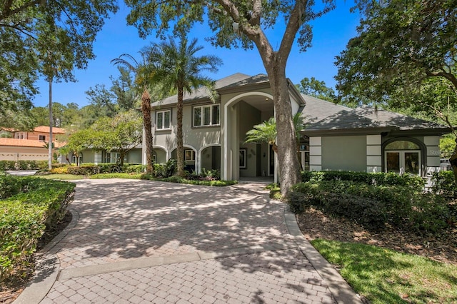 mediterranean / spanish home with stucco siding
