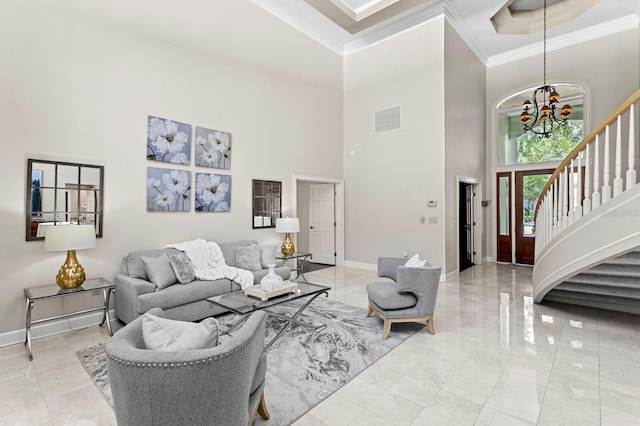 living area with baseboards, marble finish floor, ornamental molding, a chandelier, and a high ceiling