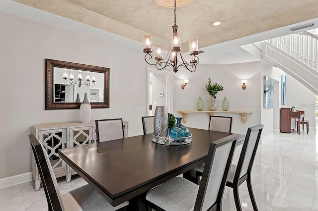 dining area with baseboards, a notable chandelier, recessed lighting, and marble finish floor