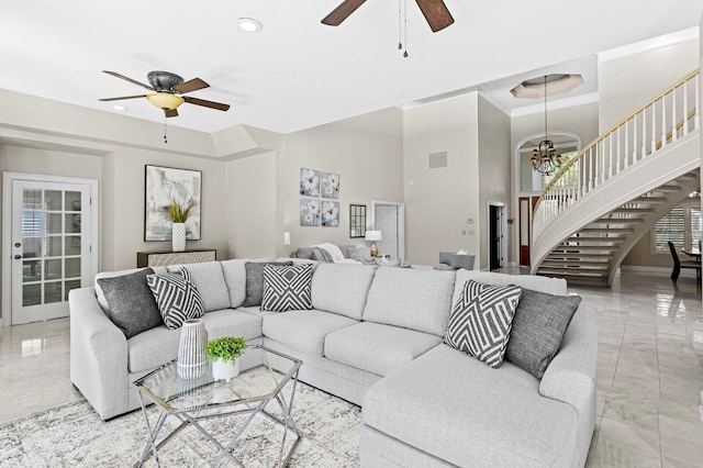 living room featuring ceiling fan with notable chandelier, marble finish floor, recessed lighting, stairway, and crown molding