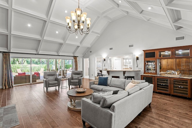living area with a chandelier, high vaulted ceiling, visible vents, and dark wood-type flooring