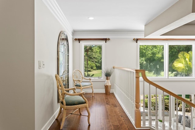 sitting room with crown molding, wood-type flooring, baseboards, and recessed lighting
