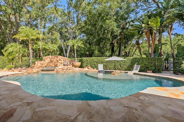 outdoor pool with a patio area