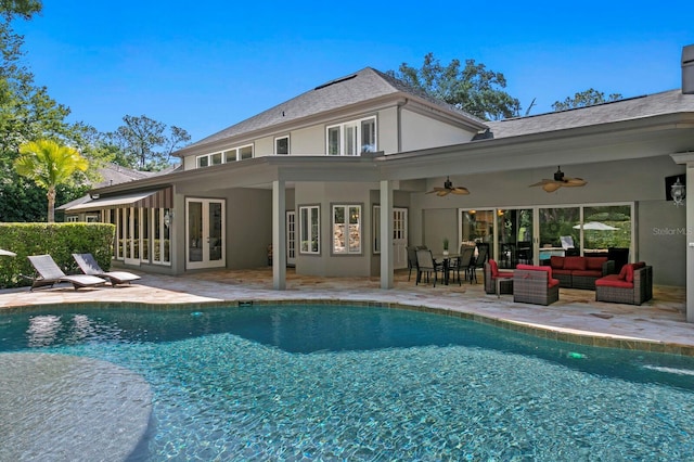 back of house with french doors, a patio, an outdoor pool, ceiling fan, and stucco siding