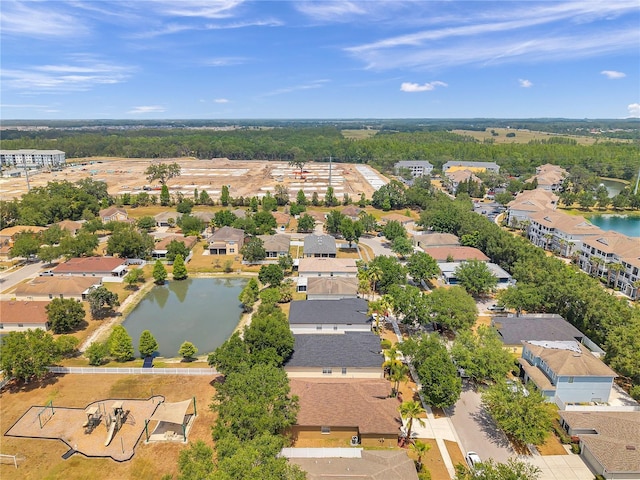 bird's eye view featuring a residential view and a water view