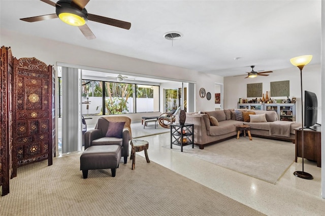 4340 50th Ter S, Saint Petersburg, FL 33711 - living room featuring ceiling fan, speckled floor, and visible vents