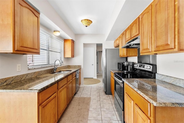 4340 50th Ter S, Saint Petersburg, FL 33711 - kitchen with light tile patterned flooring, a sink, dark stone countertops, stainless steel appliances, and under cabinet range hood