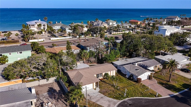 drone / aerial view featuring a water view and a residential view