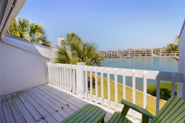 deck featuring a water view and a yard