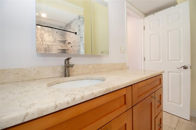 full bath with vanity, tile patterned flooring, and a shower