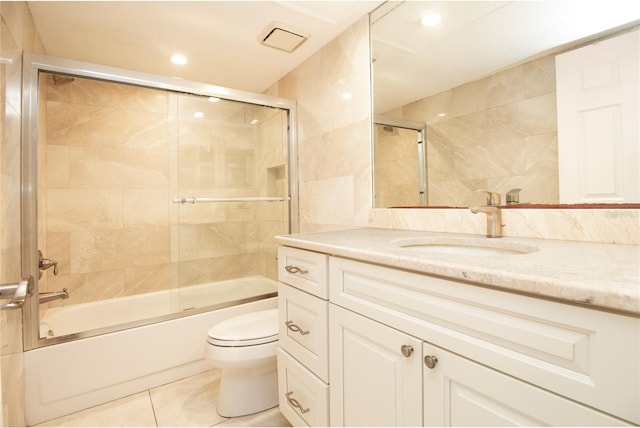 full bath featuring toilet, tile patterned flooring, enclosed tub / shower combo, vanity, and recessed lighting