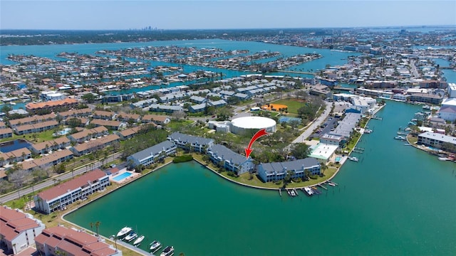 aerial view of property's location with a nearby body of water