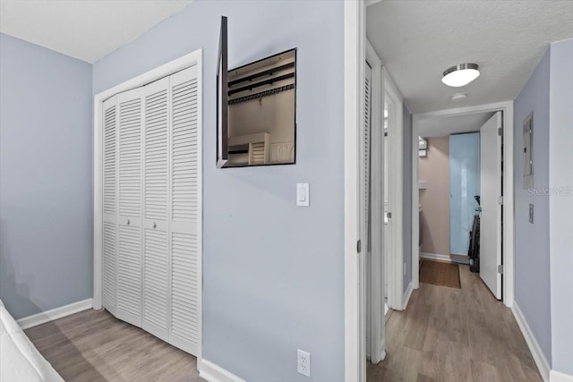 3600 Magnolia Ridge Cir Unit 1221-G, Palm Harbor, FL 34684 - corridor with wood finished floors and baseboards