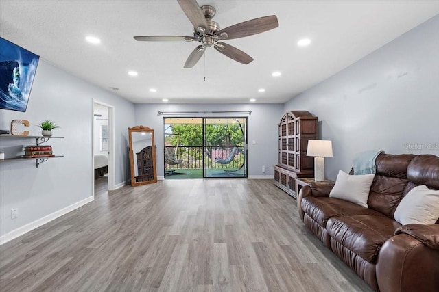 3600 Magnolia Ridge Cir Unit 1221-G, Palm Harbor, FL 34684 - living area featuring wood finished floors, ceiling fan, recessed lighting, and baseboards