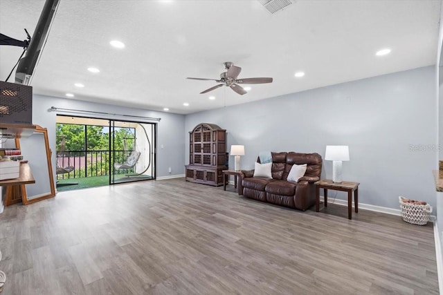 3600 Magnolia Ridge Cir Unit 1221-G, Palm Harbor, FL 34684 - sitting room featuring visible vents, baseboards, recessed lighting, wood finished floors, and a ceiling fan