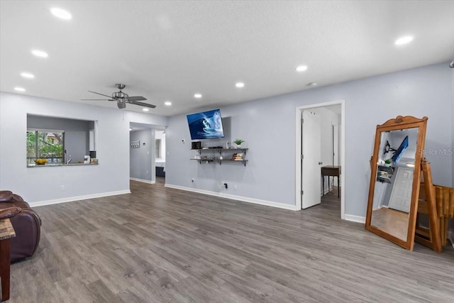 3600 Magnolia Ridge Cir Unit 1221-G, Palm Harbor, FL 34684 - living room with wood finished floors, recessed lighting, and baseboards