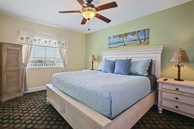 399 2nd St Unit 313, Indian Rocks Beach, FL 33785 - bedroom featuring ceiling fan, baseboards, and dark carpet