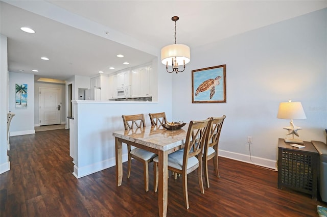 399 2nd St Unit 313, Indian Rocks Beach, FL 33785 - dining area with baseboards, a notable chandelier, recessed lighting, and dark wood-type flooring