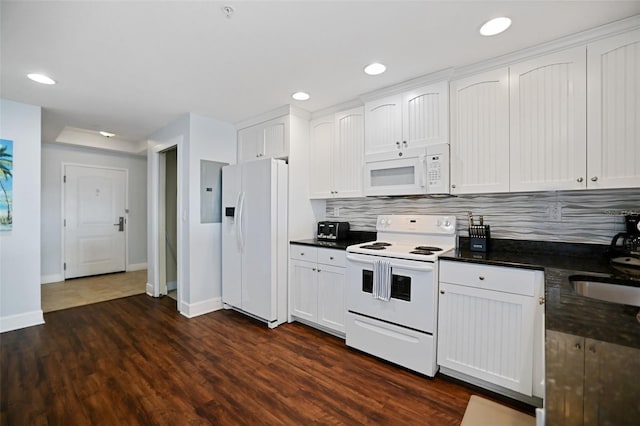 399 2nd St Unit 313, Indian Rocks Beach, FL 33785 - kitchen featuring dark countertops, tasteful backsplash, baseboards, and white appliances
