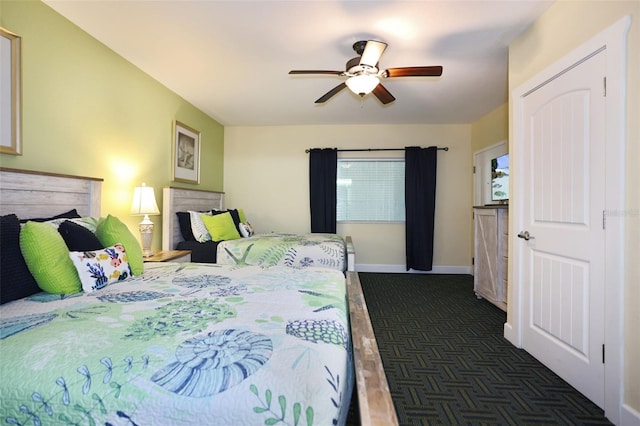 399 2nd St Unit 313, Indian Rocks Beach, FL 33785 - bedroom with baseboards and a ceiling fan